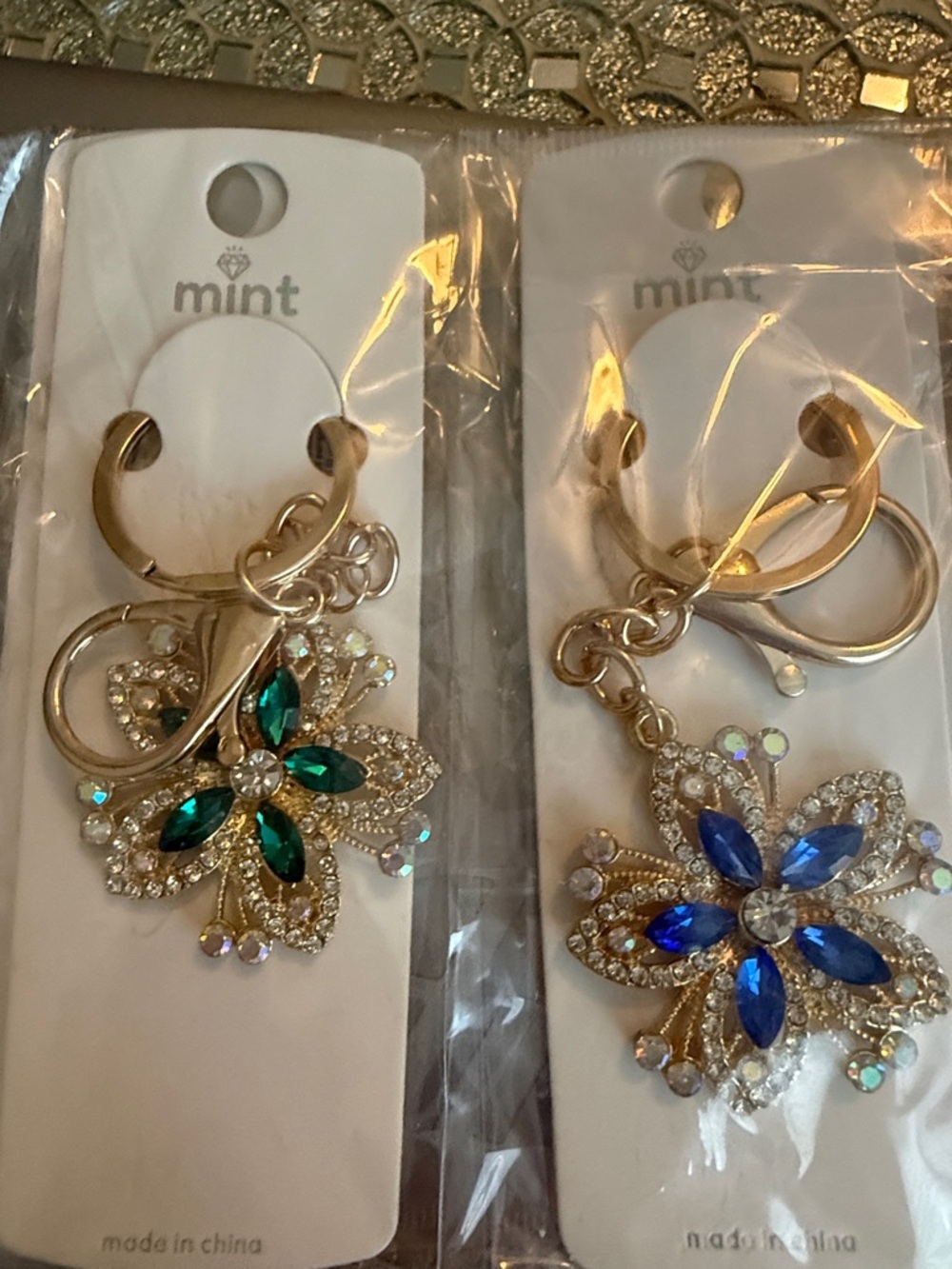 12 Pack Rhinestone & Crystal Flower Key Chains Set in Gild Tone.